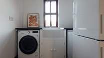 Useful utility-room with washing machine, off the boot-room. A handy space for dog care, buckets and spades or muddy walking boots. 