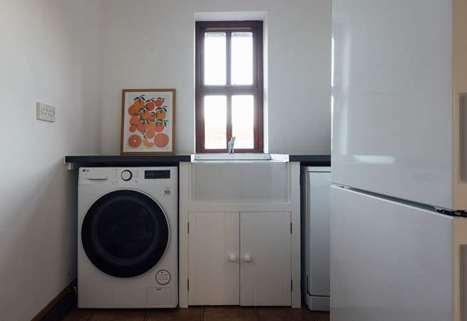 Useful utility-room with washing machine, off the boot-room. A handy space for dog care, buckets and spades or muddy walking boots. 
