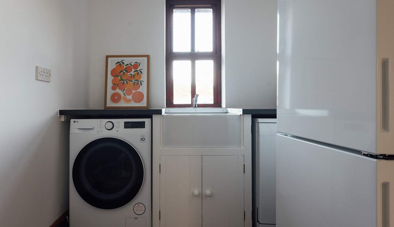 Useful utility-room with washing machine, off the boot-room. A handy space for dog care, buckets and spades or muddy walking boots. 