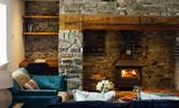 Soothe your soul in the glow of the warming wood burner. Ideal after a swim in the sea or a mountain hike.  - Thumbnail Image