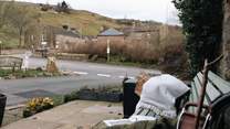 Enjoy a moment on the bench outside watching village life go by.