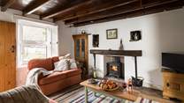 Cosy up in front of the wood-burner after a long day walking the hills.