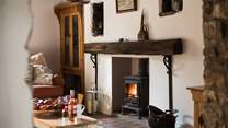 Enjoy a drink in front of the fire.