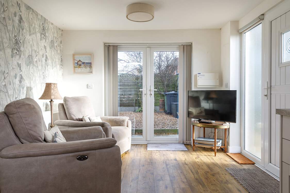 The reclining chairs in the open plan living area add to a relaxing stay.