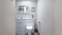 Your bathroom awaits, enjoy a bubble bath or shower, tucked around the corner..