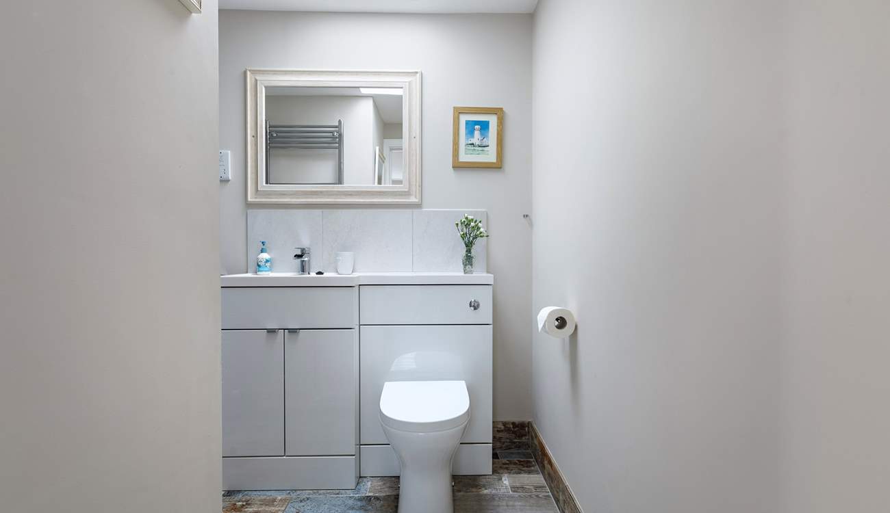 Your bathroom awaits, enjoy a bubble bath or shower, tucked around the corner..