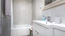A relaxing space with full size bath and fitted shower.