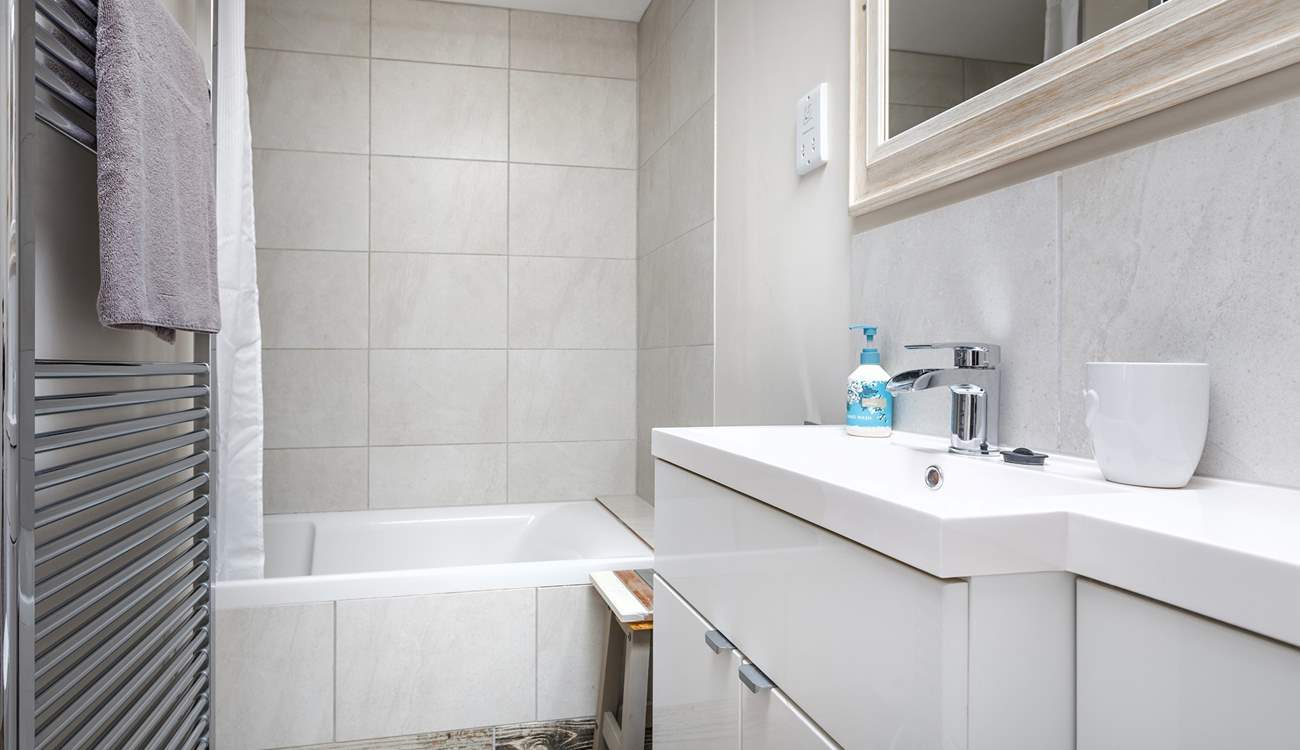 A relaxing space with full size bath and fitted shower.