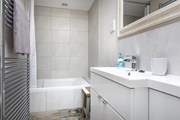 A relaxing space with full size bath and fitted shower.
