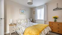 When the time comes to call it a night, you will find a lovely bed for a relaxing night's sleep.