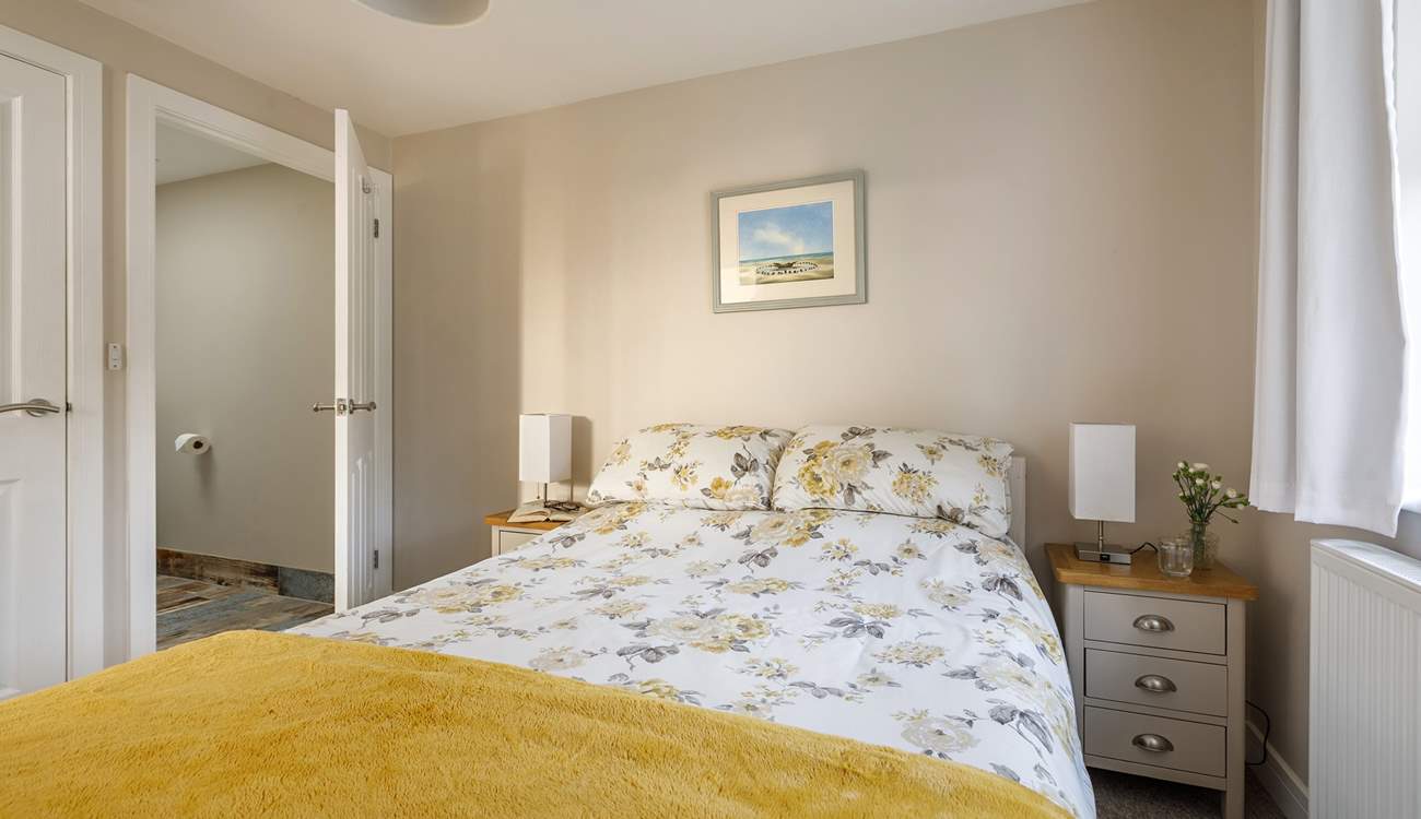 Open the door to your generous en suite bathroom.