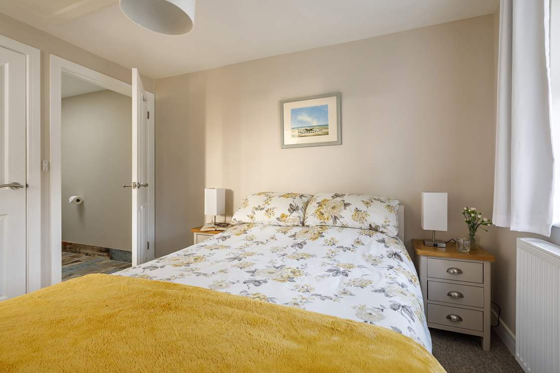 Open the door to your generous en suite bathroom.