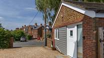 Just moments from the village centre and promenade.