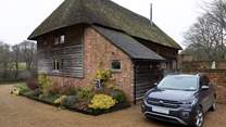 Space beside the barn to park two cars.