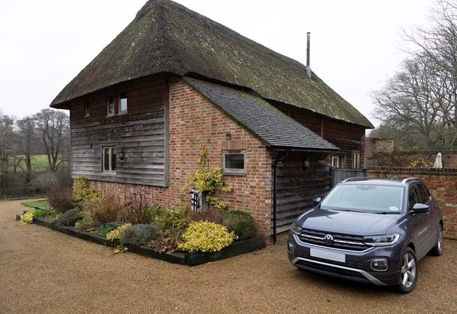 Space beside the barn to park two cars.