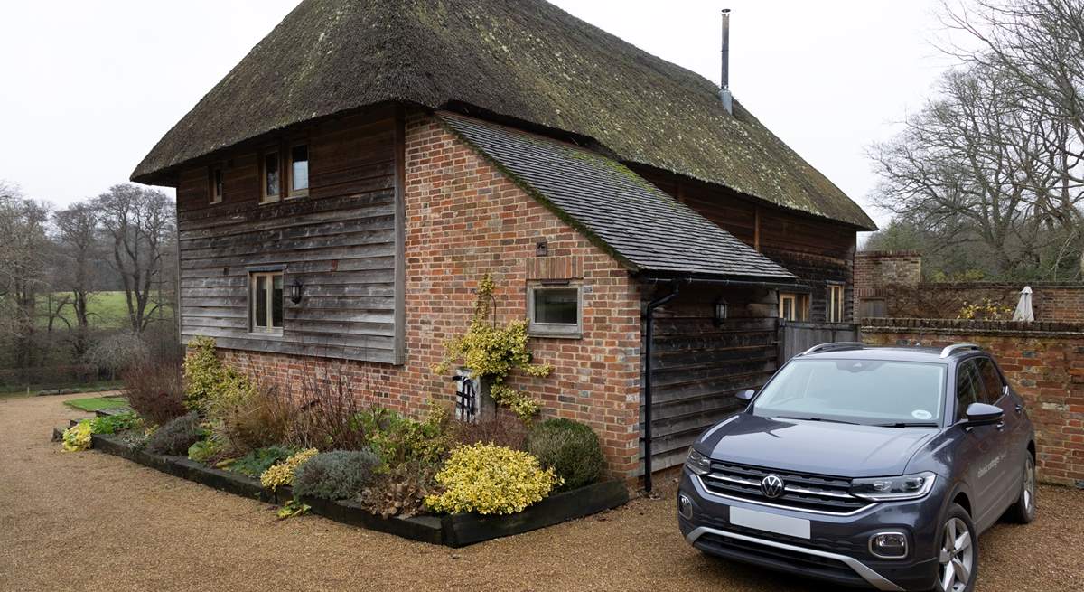 Space beside the barn to park two cars.