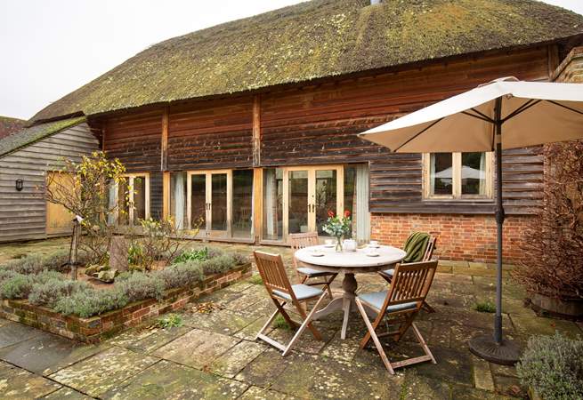 Step out through the doors to an enclosed private courtyard garden.  
