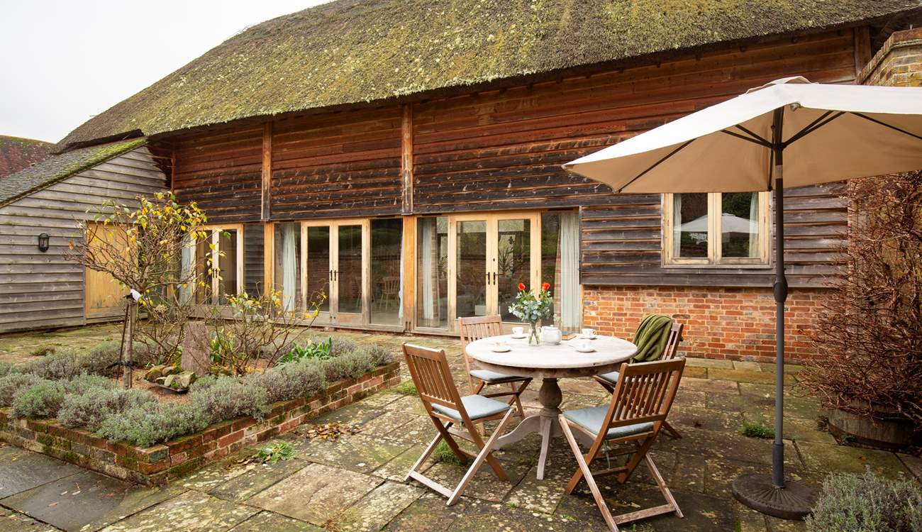 Step out through the doors to an enclosed private courtyard garden.  