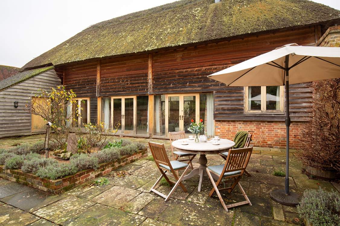 Step out through the doors to an enclosed private courtyard garden.