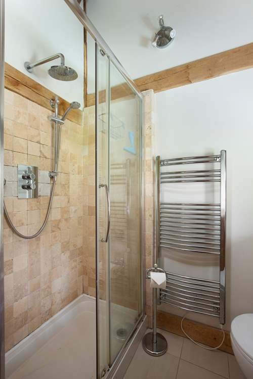 With en suite shower and heated towel rail.