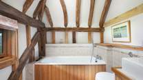 Enjoy a bedtime soak in the en suite bathroom.