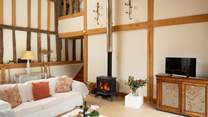 Get cosy in front of the wood-burner, relax and watch movies together.