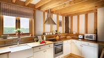 The country-style kitchen has all you need to rustle up a culinary feast. 
