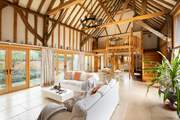 A spacious holiday barn with characterful beams add to its charm.