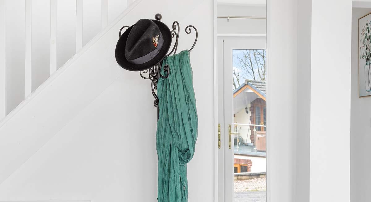 Hang up your hat and head upstairs to the sitting-room and balcony.