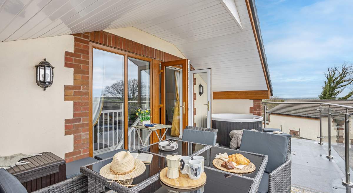 Open the door and head out to the balcony, the perfect spot for the family to relax and enjoy a bite to eat.