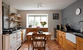 The country style kitchen is ideal for cooking up feasts. (Please note the Aga is ornamental and not for guests' use). - Thumbnail Image