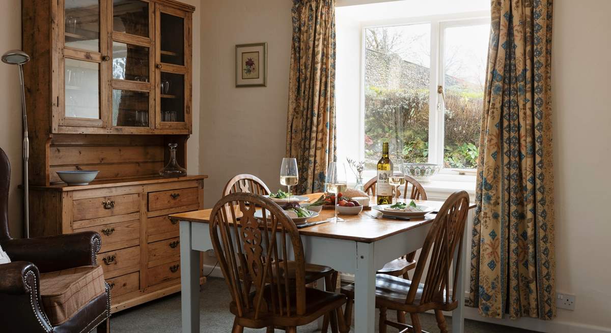 A separate dining-room offers space to enjoy meals in together.