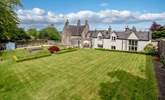 The Coach House is the white part of the property, with the private terrace and lawned area to the right-hand side out of shot. This photo is taken stood in the owners' garden. - Thumbnail Image