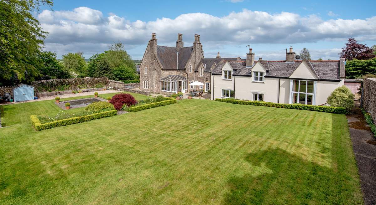 The Coach House is the white part of the property, with the private terrace and lawned area to the right-hand side out of shot. This photo is taken stood in the owners' garden.