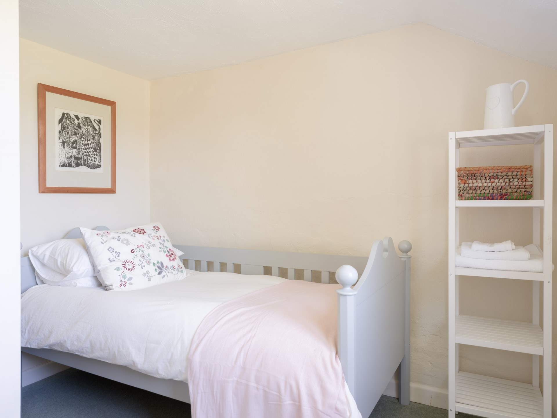 A sweet single bedroom awaits you.