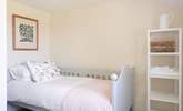 A sweet single bedroom awaits you. - Thumbnail Image