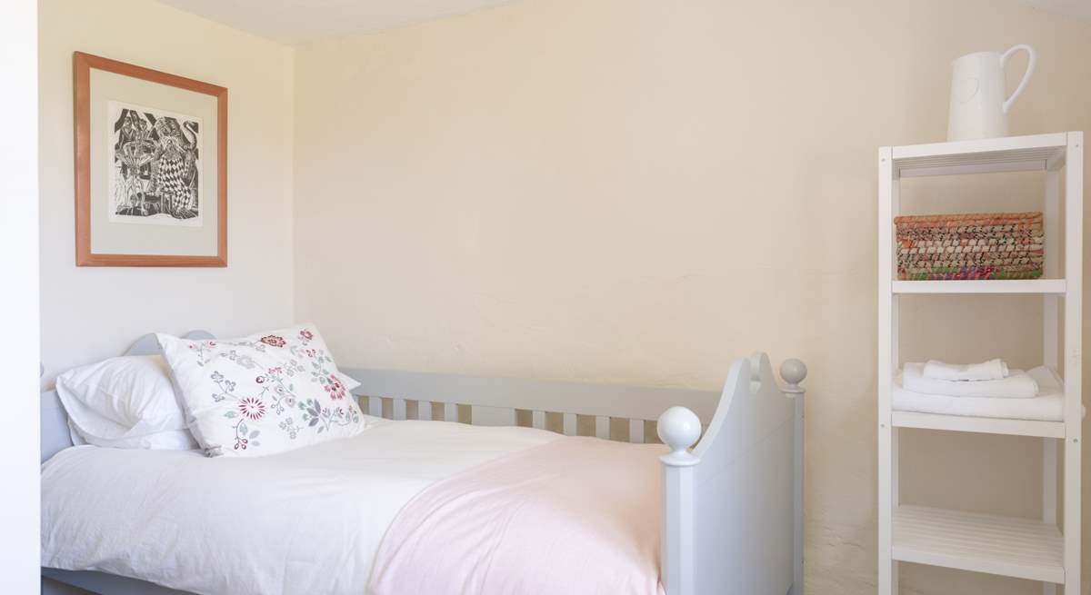 A sweet single bedroom awaits you.
