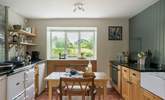 The country style kitchen is ideal for cooking up feasts and soaking in the beautiful gardens. - Thumbnail Image