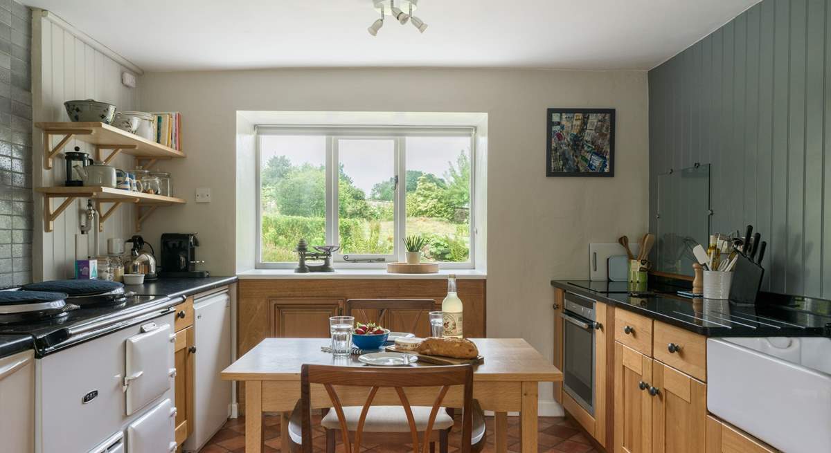 The country style kitchen is ideal for cooking up feasts and soaking in the beautiful gardens.