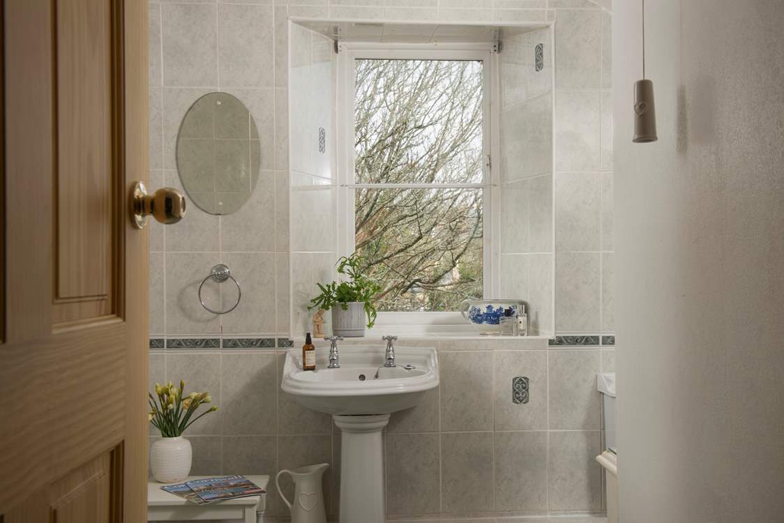 The family bathroom sits between the two bedrooms, mind the steps leading to these rooms.