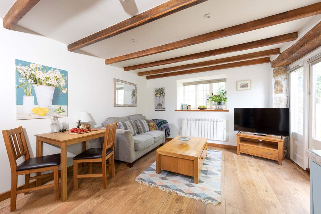 Snuggle up on the sofa, enjoy the views or pull the blinds down and watch a movie on darker evenings.