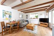 Snuggle up on the sofa, enjoy the views or pull the blinds down and watch a movie on darker evenings.