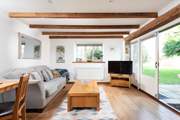 The huge doors entice you out to the beautiful gardens straight from the cleverly designed open plan living area.