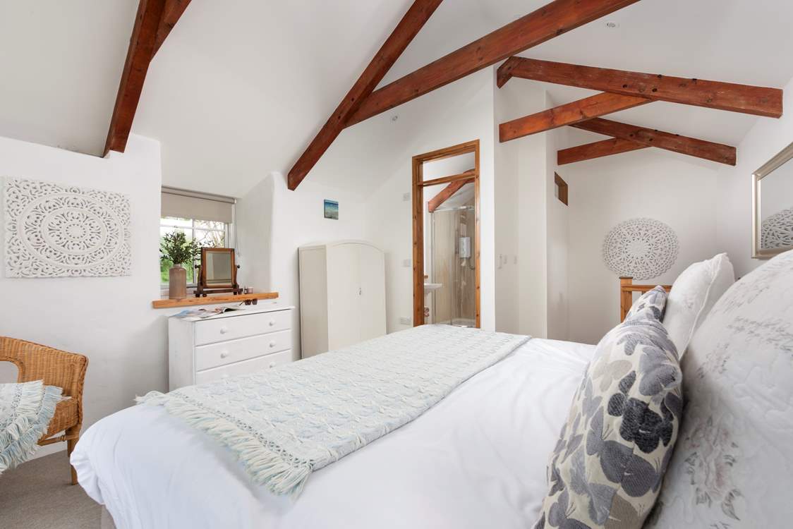 It's just a few steps from the king-size bed to the modern en suite shower-room.