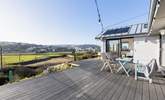 The large terrace has a lovely outlook over fields and Perranporth (there will be a low fence/ planters on the edge of the decking and new furniture too).  - Thumbnail Image