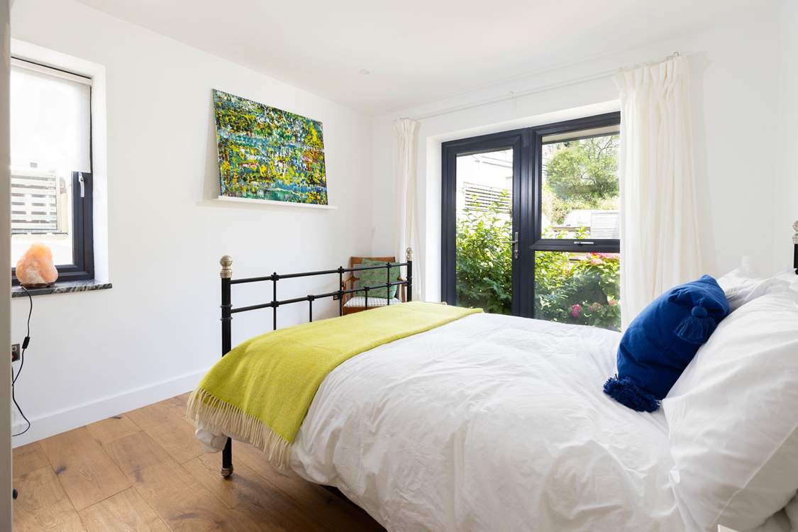 This bedroom overlooks the back of the house with its scented lavender.