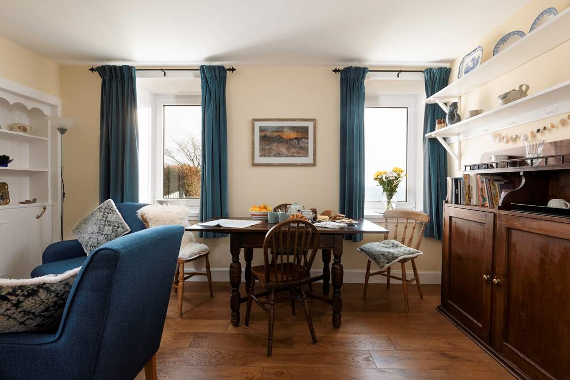 The beautiful traditional dining-room has amazing views too, plus an open fire for cosy stays.