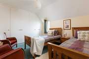 The spacious twin bedroom has fantastic views over the sea.