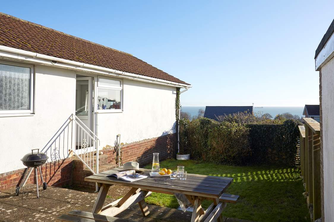 From the back door, four steps lead to the secluded garden.