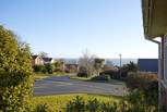 Looking down the road towards the village centre, seafront and beaches. 